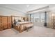 Inviting main bedroom with a wooden bed frame and ample natural light at 4116 Tory Path Rd, Waxhaw, NC 28173