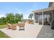 Outdoor patio with comfortable seating, string lights, and view of the backyard at 4116 Tory Path Rd, Waxhaw, NC 28173