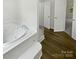 Relaxing bathroom features a luxurious soaking tub and glass-enclosed walk-in shower at 424 Mallard Dr, Pineville, NC 28134