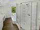 Bright bathroom with walk-in glass shower, soaking tub, and dual sink vanity at 424 Mallard Dr, Pineville, NC 28134