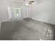 Expansive bedroom area leading to an ensuite bathroom with a full wall of custom shelves at 424 Mallard Dr, Pineville, NC 28134