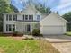 Charming two-story home with a well-maintained lawn and attached two-car garage at 424 Mallard Dr, Pineville, NC 28134