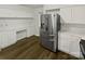 Spacious kitchen featuring stainless steel appliances, ample counter space, and built-in desk area at 424 Mallard Dr, Pineville, NC 28134