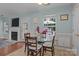 Charming dining area with fireplace and backyard views at 5221 Javitz Rd, Charlotte, NC 28216
