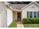 Home's entryway offers easy access from the driveway with well-manicured shrubs at 5221 Javitz Rd, Charlotte, NC 28216
