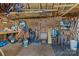 Organized garage space provides ample storage for tools, gardening equipment, and bikes hanging from the ceiling at 5221 Javitz Rd, Charlotte, NC 28216