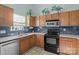 Bright kitchen featuring light oak cabinets, stainless appliances, and ample counter space at 5221 Javitz Rd, Charlotte, NC 28216
