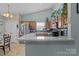 Modern kitchen featuring stainless steel appliances, granite countertops, and stylish backsplash at 5221 Javitz Rd, Charlotte, NC 28216