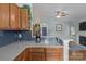Modern kitchen featuring oak cabinets and view to living space at 5221 Javitz Rd, Charlotte, NC 28216
