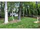 Backyard shed with white trim and wooden ramp at 5221 Javitz Rd, Charlotte, NC 28216