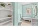 Bathroom featuring a clawfoot tub, custom shelving and ample natural light at 524 W Horah St, Salisbury, NC 28144