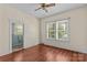 A bedroom with hardwood floors, bright natural light, and an ensuite bathroom at 524 W Horah St, Salisbury, NC 28144