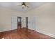 Bedroom featuring hardwood floors, multiple doors, and neutral wall paint at 524 W Horah St, Salisbury, NC 28144
