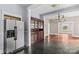 A dining room with a built-in hutch and hardwood floors that flow into the living room at 524 W Horah St, Salisbury, NC 28144