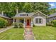 Charming home with inviting curb appeal, a red front door, and lush green lawn at 524 W Horah St, Salisbury, NC 28144