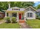 Charming home with inviting curb appeal, a red front door, and lush green lawn at 524 W Horah St, Salisbury, NC 28144