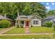 Charming home with inviting curb appeal, a red front door, and lush green lawn at 524 W Horah St, Salisbury, NC 28144