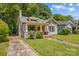 Charming bungalow home with red door, lush lawn and mature trees at 524 W Horah St, Salisbury, NC 28144