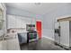 A kitchen featuring stainless steel appliances, tile backsplash, and a bright red door at 524 W Horah St, Salisbury, NC 28144