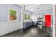 Well-lit kitchen with grey cabinets, tiled backsplash, stainless appliances and a chandelier at 524 W Horah St, Salisbury, NC 28144