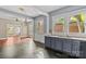 A kitchen with a double basin sink, granite countertops, and an open view to the living room at 524 W Horah St, Salisbury, NC 28144