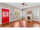 Living room showcasing a red front door, fireplace with mantel, and hardwood floors at 524 W Horah St, Salisbury, NC 28144