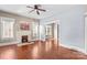 Bright living room featuring hardwood floors, a decorative fireplace, and ample natural light at 524 W Horah St, Salisbury, NC 28144