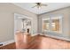 Comfortable living room featuring hardwood floors, a fireplace, and plenty of natural light from the windows at 524 W Horah St, Salisbury, NC 28144