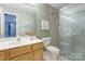 Well-lit bathroom featuring a single sink vanity, and a glass-enclosed shower at 5610 Monticello Nw Dr, Concord, NC 28027