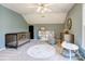 Stylish bedroom featuring a crib, patterned rug, and neutral furniture at 5610 Monticello Nw Dr, Concord, NC 28027