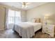 Cozy bedroom featuring a queen-size bed, soft lighting, and neutral paint color at 5610 Monticello Nw Dr, Concord, NC 28027