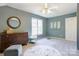 Bright bedroom with neutral walls, a round patterned rug, and natural light at 5610 Monticello Nw Dr, Concord, NC 28027