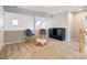 Cozy bonus room with carpet flooring, neutral paint and comfortable seating at 5610 Monticello Nw Dr, Concord, NC 28027