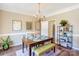 Elegant dining room featuring a wooden table, chandelier, and stylish decor at 5610 Monticello Nw Dr, Concord, NC 28027