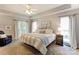 Calm, bright main bedroom featuring a king bed, ample natural light, and neutral color scheme at 5610 Monticello Nw Dr, Concord, NC 28027