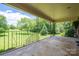 View from covered porch showing mature backyard trees and greenery at 5635 Highway 55 E Hwy, Clover, SC 29710