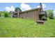 Brick home's exterior, showcasing the yard, patio, and chimney at 5635 Highway 55 E Hwy, Clover, SC 29710