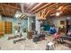 Finished basement area with exposed beams, exercise equipment and other storage at 5635 Highway 55 E Hwy, Clover, SC 29710
