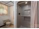 Bathroom with enclosed shower and neutral tile at 5635 Highway 55 E Hwy, Clover, SC 29710