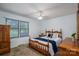 Cozy bedroom featuring a full bed, a window with blinds, and wooden furniture at 5635 Highway 55 E Hwy, Clover, SC 29710