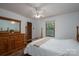Bedroom featuring a full bed, wood furniture, and a window that provides natural light at 5635 Highway 55 E Hwy, Clover, SC 29710