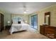 Bedroom features a full bed, wood furniture, slider to deck, and bright wallpaper at 5635 Highway 55 E Hwy, Clover, SC 29710