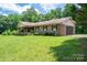 Charming single-story brick home with a well-manicured lawn and covered porch at 5635 Highway 55 E Hwy, Clover, SC 29710