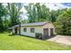 Ranch-style home features a two-car garage and vinyl siding, set on a green lawn with mature trees at 5635 Highway 55 E Hwy, Clover, SC 29710