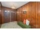 Foyer with wood paneling, double doors, and a unique light fixture at 5635 Highway 55 E Hwy, Clover, SC 29710
