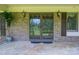 Inviting front door with sidelights, set in a brick facade with decorative exterior lighting at 5635 Highway 55 E Hwy, Clover, SC 29710