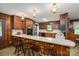 Kitchen with wooden paneled walls and cabinets, long countertops, and overhead lighting at 5635 Highway 55 E Hwy, Clover, SC 29710