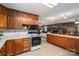 Kitchen with tile floors and counter tops, wooden cabinets and stainless steel appliances at 5635 Highway 55 E Hwy, Clover, SC 29710