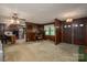 Open living area with wood paneling and access to the kitchen and entry at 5635 Highway 55 E Hwy, Clover, SC 29710