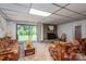 Bright living area with fireplace, sliding glass door, and cozy furnishings at 5635 Highway 55 E Hwy, Clover, SC 29710